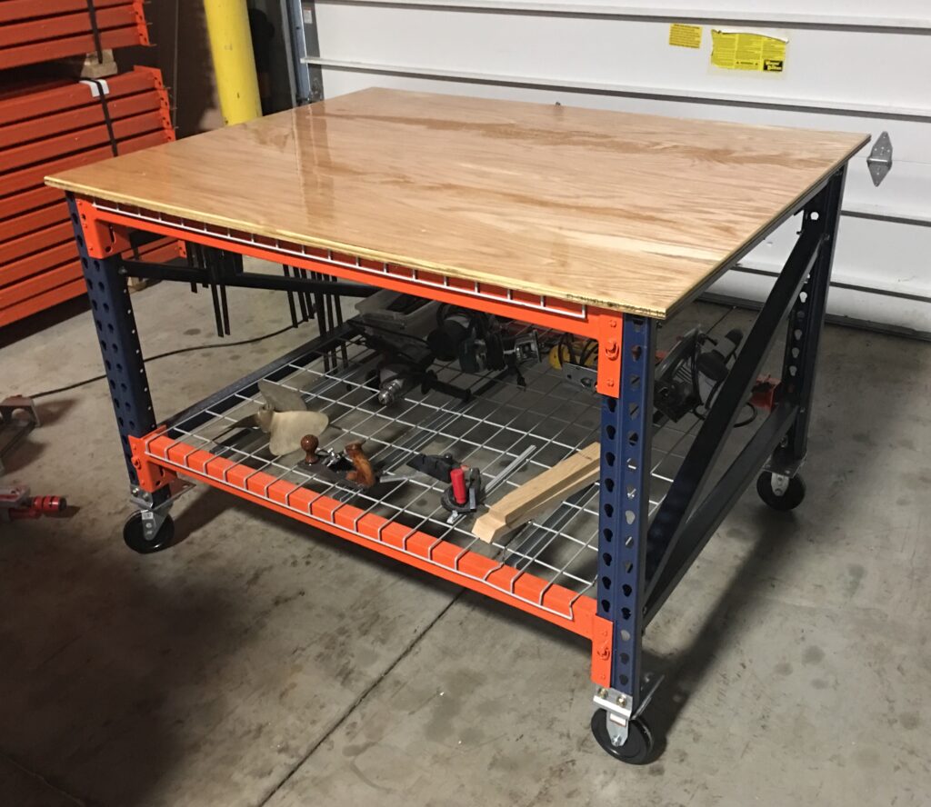 mobile pallet rack workbench with plywood top and wire deck shelf