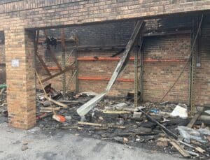 Fire-damaged storage building with pallet rack still standing after major fire in Dublin Ohio