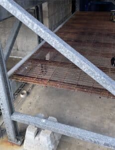 rusty wire deck panel on galvanized pallet racking for outdoor use