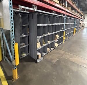 High density small parts storage system installed within warehouse pallet racking during relocation project