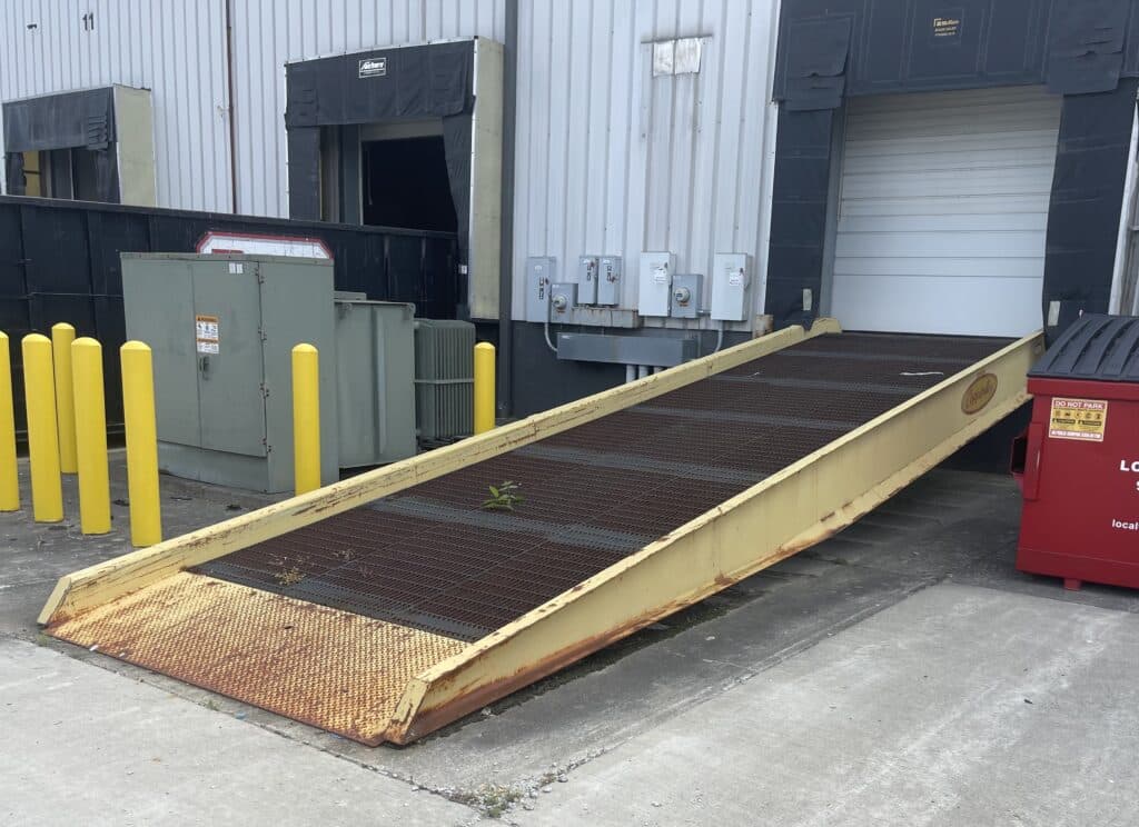 Copperloy- JH Industries steel ground to dock yard ramp with serrated deck