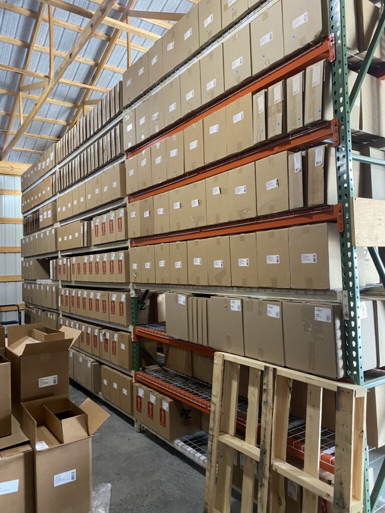 Vinyl records stored on Husky Rack & Wire teardrop pallet rack using wire decking and 24-inch deep uprights