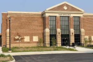 Custom pallet rack and wire security enclosure installed at Thomas Worthington High School theater scene shop