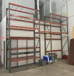 Selective pallet rack with controlled access wire security cage for theater equipment storage