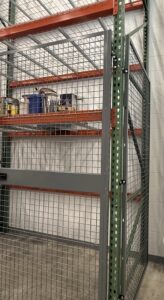 Close-up of modular wire panel bolted to pallet rack upright