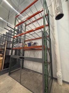 Lockable wire enclosure attached to existing pallet rack